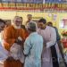 GFA (Gospel for Asia) founder and director Dr. K.P. Yohannan (center) helps distribute relief supplies in a predominantly Buddhist community while visiting Sri Lanka to see the organization’s ongoing relief efforts after severe flooding.