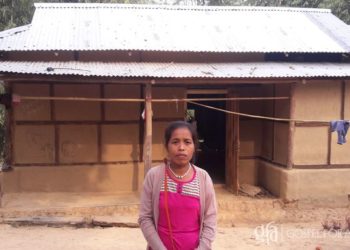 Through a Christmas gift distribution, Harmya received two bundles of tin sheets! These sheets provided stability and protection for her home.