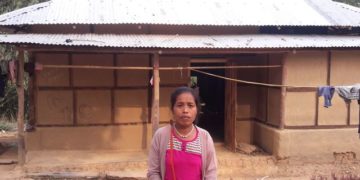 Through a Christmas gift distribution, Harmya received two bundles of tin sheets! These sheets provided stability and protection for her home.