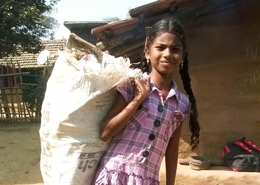 It was Asha’s daily ritual to rise early in the morning to go picking through trash with her mother. When it came time for school, Asha didn’t want to go.