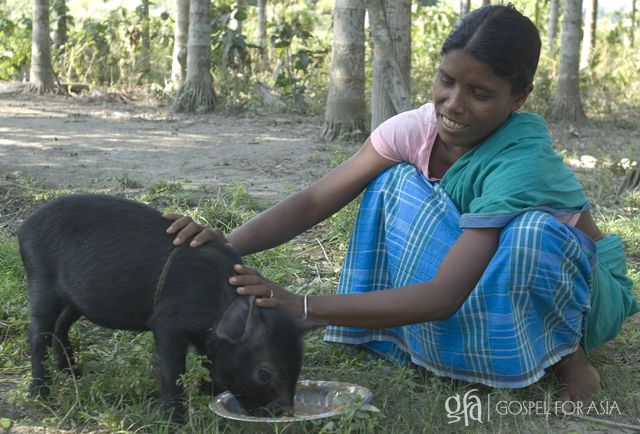 The gift the GFA-supported pastor held in his hands would change her life for the better. With tears of joy, she happily accepted the piglet.