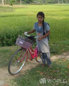 Discussing Moira, her dream to be a teacher hindered by distance and exhaustion, relieved through GFA World gift distribution of a bicycle.
