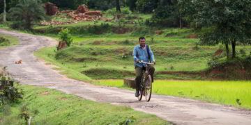 Through the aid of a bicycle gifted by GFA World's Christmas gift distribution program, GFA World Pastor helps transform lives in his region.