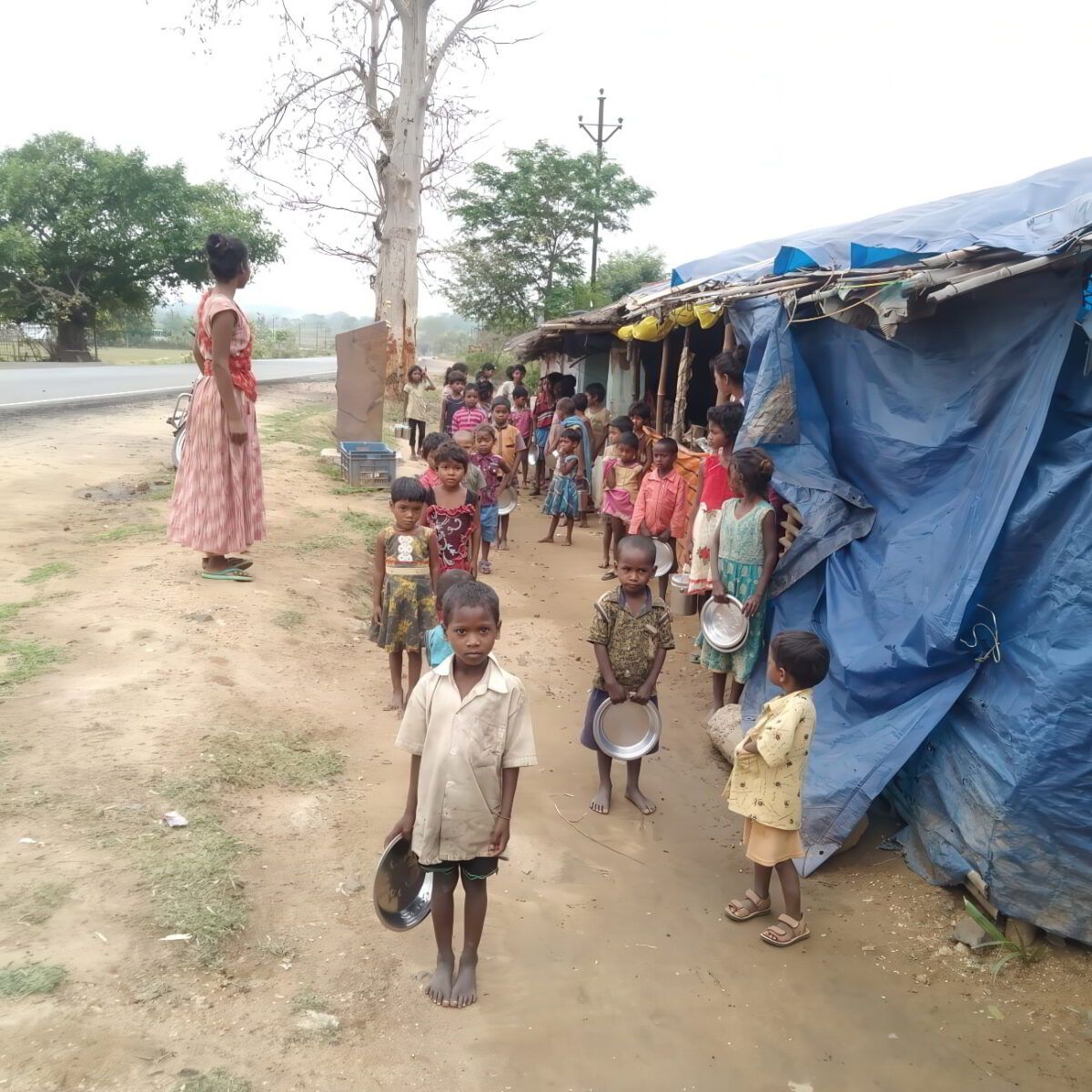 Hungry kids and their families line up for a free food distribution in Jarkhand, India, provided by GFA-supported local churches.
